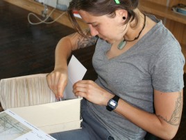 Intern focusing on filing collection cards